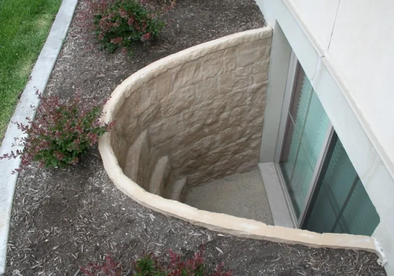 Decorative Basement Window Well Providing Improved Drainage, Natural Light, and Easy Access While Protecting the Foundation from Surrounding Soil | Piermagic®